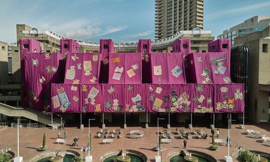 ibrahim mahama's purple fabric wraps the facade of our lakeside terrace