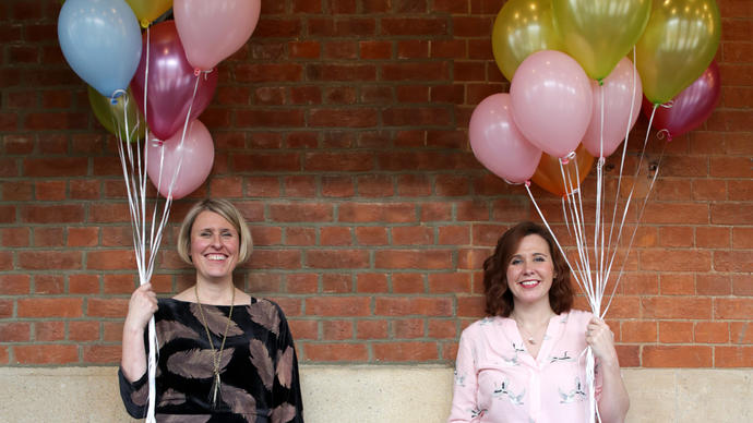 Two women with balloons