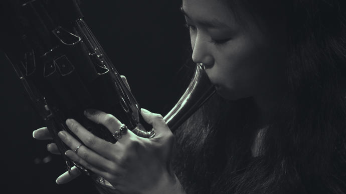 Park Jiha playing a traditional wind instrument