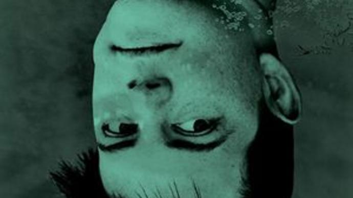 photo of nico muhly upside down in some water, with a green wash over it