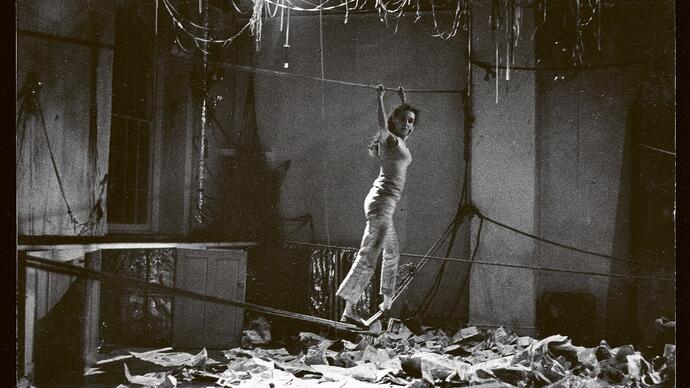 black and white photo of Carolee Schneemann performing Water Light / Water Needle