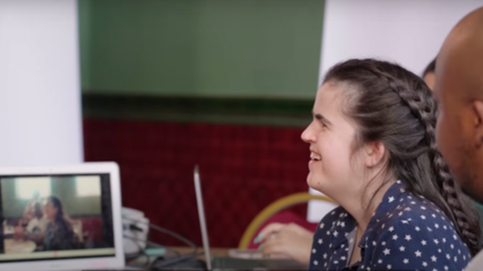 Rachel, the director of Perfect Show for Rachel, smiles in the rehearsal room.