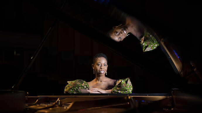 Samantha Ege sat in front of a grand piano