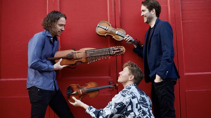 Lodestar Trio holding their instruments