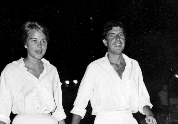 marianne and leonard walking together both wearing all white