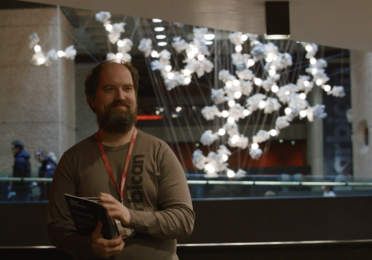 Man with beard in the Barbican foyer