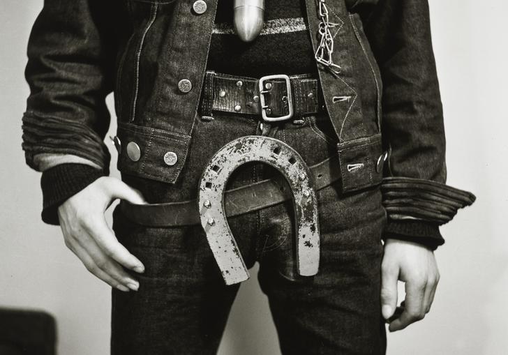 Image of man with horseshoe over his crotch 