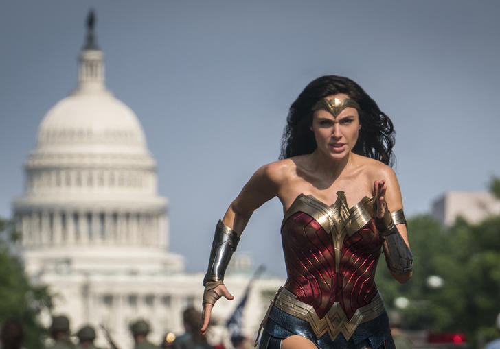 Wonder Woman runs with the backdrop of the United States Senate