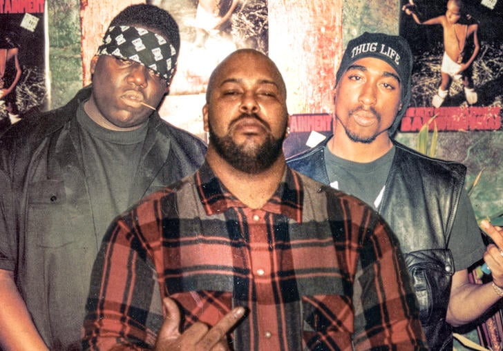 Biggie Smalls, Suge Knight and Tupac Shakur pose together in a photograph