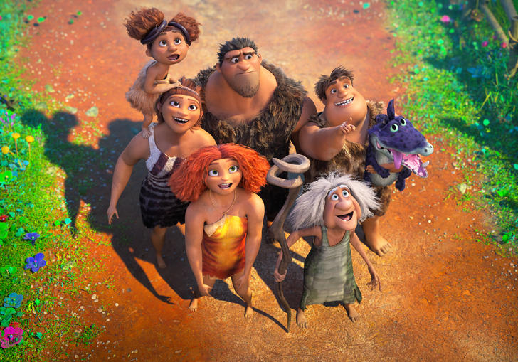 the croods stand together on a path looking up at the sky