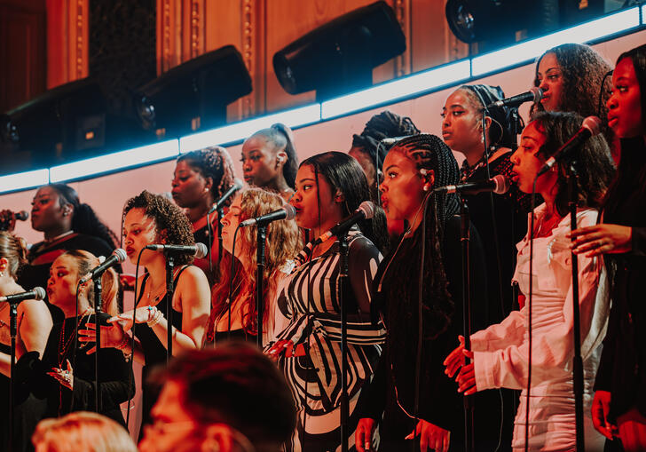 Singers in the gospel choir performing on stage