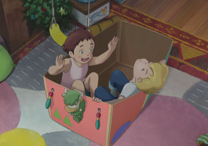 Two children play in a cardboard box.