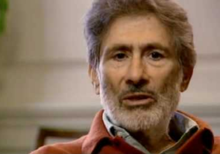 Edward Said sits in a chair