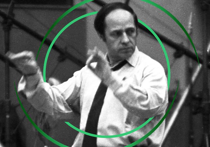 Black and white photo of Boulez conducting, with green circular swirls around him