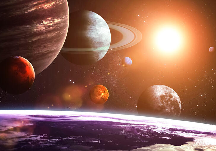 the earth in the foreground with the other planets in the solar system behind it