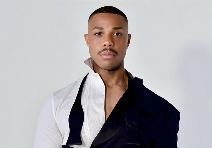 Davone Tines in an avant garde suit