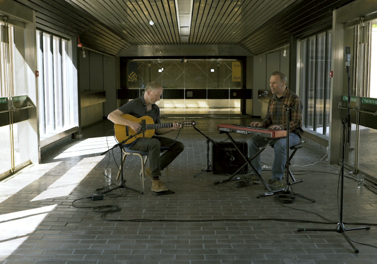 Two men playing instruments