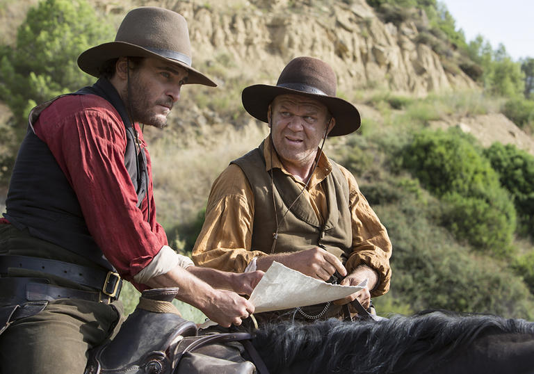 John C Reilly and Joaquin Phoenix on horseback