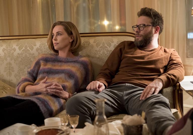 Charlize Theron and Seth Rogen on a couch