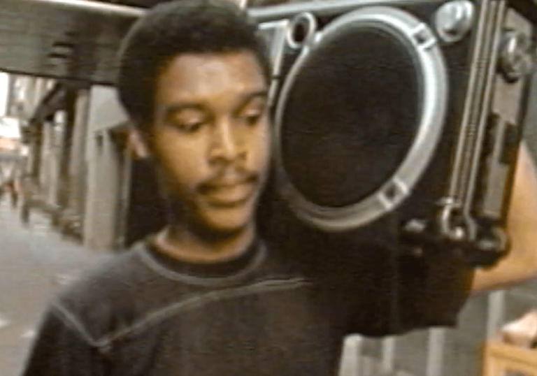 a man in 80s nyc with a boombox