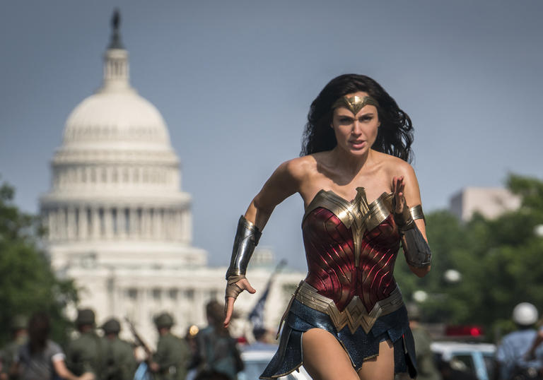 Wonder Woman runs with the backdrop of the United States Senate