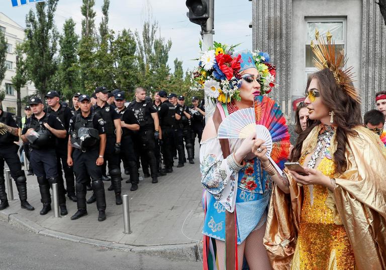 Police officers guard participants of the Equality March, organized by the LGBT community, in Kiev, Ukraine June 23, 2019. REUTERS/Gleb Garanich