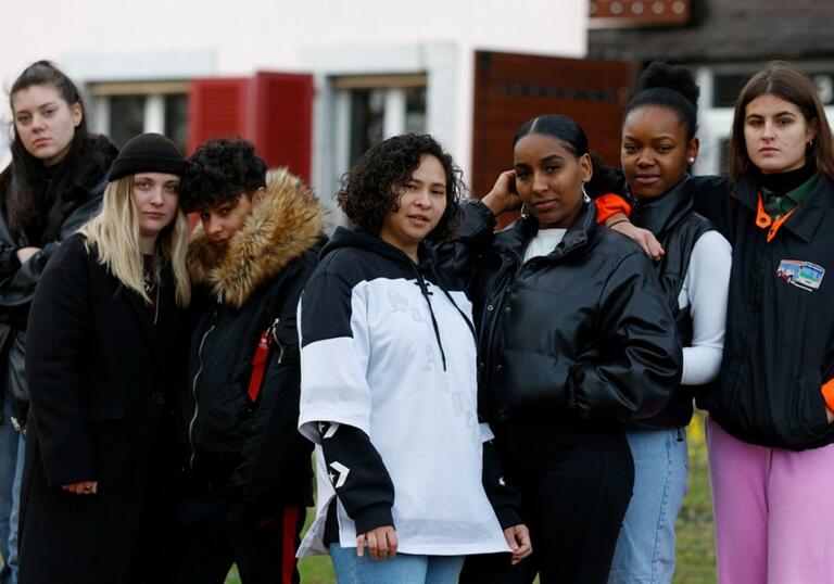 Group of teenagers standing together outside