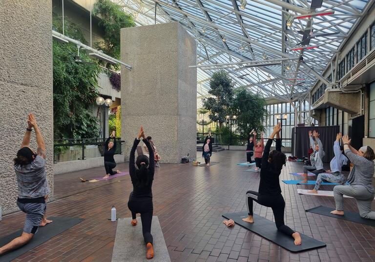 Members' Yoga class in the Conservatory with live cello