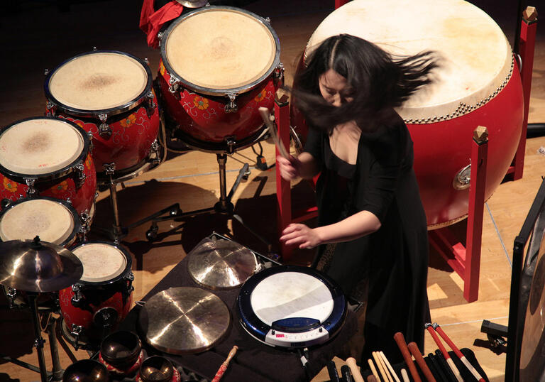 A percussionist plays Chinese drums