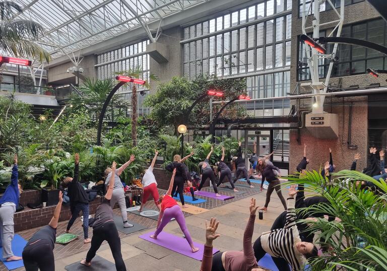 Members doing yoga in the Conservatory Well.