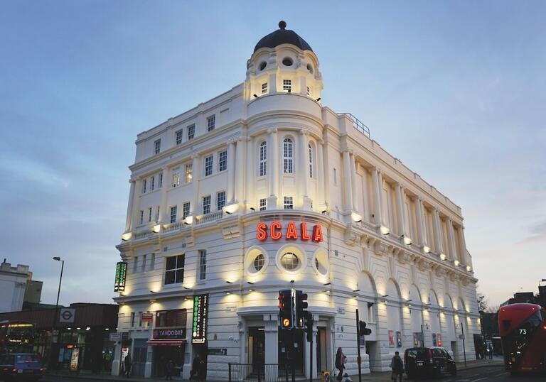 A picture of Scala cinema against a nights' sky.