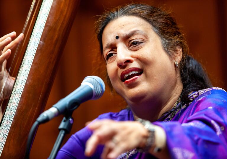 Ashwini Bhide Deshpande singing into a microphone