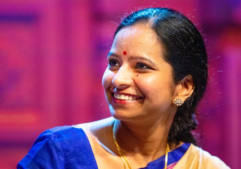 Jayanthi Kumaresh smiling while looking to her right