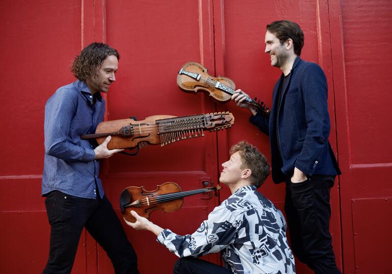 Lodestar Trio holding their instruments