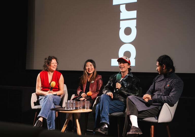 four people sitting at a screentalk panel