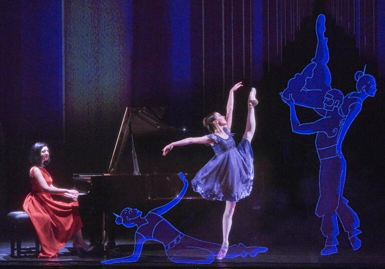 Ballerina and pianist performing next to animated ballerinas