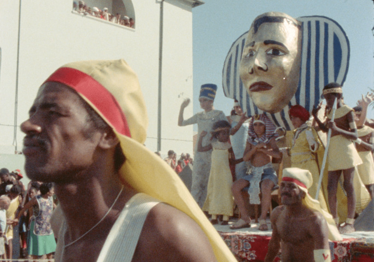 A man stands in a Carnival parade.