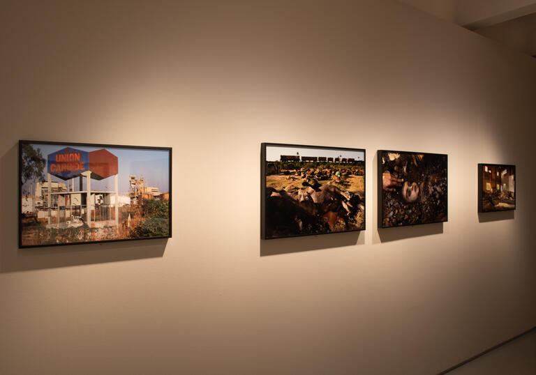 A photo of some of Pablo Bartholomew's photographs on the wall in the Barbican Art Gallery