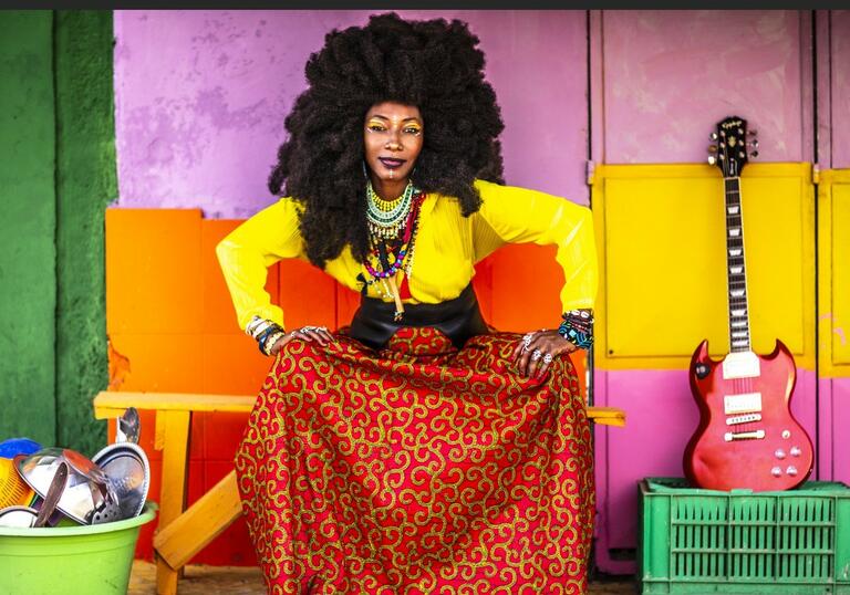 fatoumata diawara, afro hair, colourful background