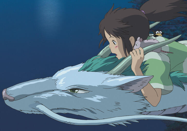 A girl rides on the back of a dragon-like creature over water. 