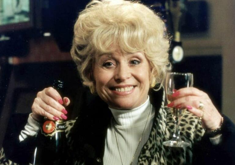 Peggy Mitchell behind the bar of the Old Vic. 