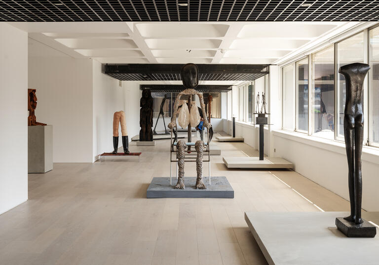 A shot of the gallery, showing sculptures by Giacometti and Huma Bhabha.