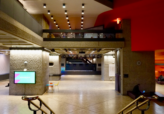 An empty, well-lit foyer with no people or furniture