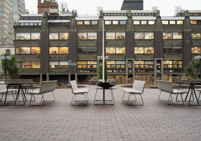 The white, inflexible tables and benches on the Lakeside 