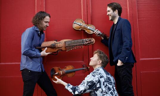 Lodestar Trio holding their instruments