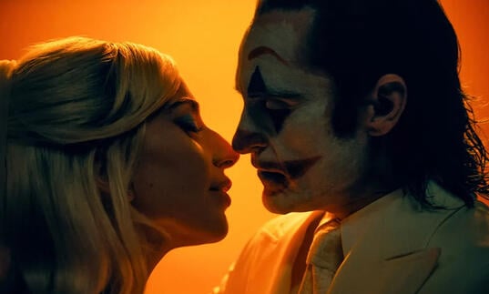 Harley and Joker go in for a kiss