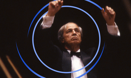 Pierre Boulez conducting, with blue circular swirls around him