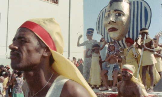 A man stands in a Carnival parade.