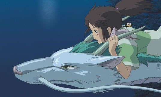 A girl rides on the back of a dragon-like creature over water. 